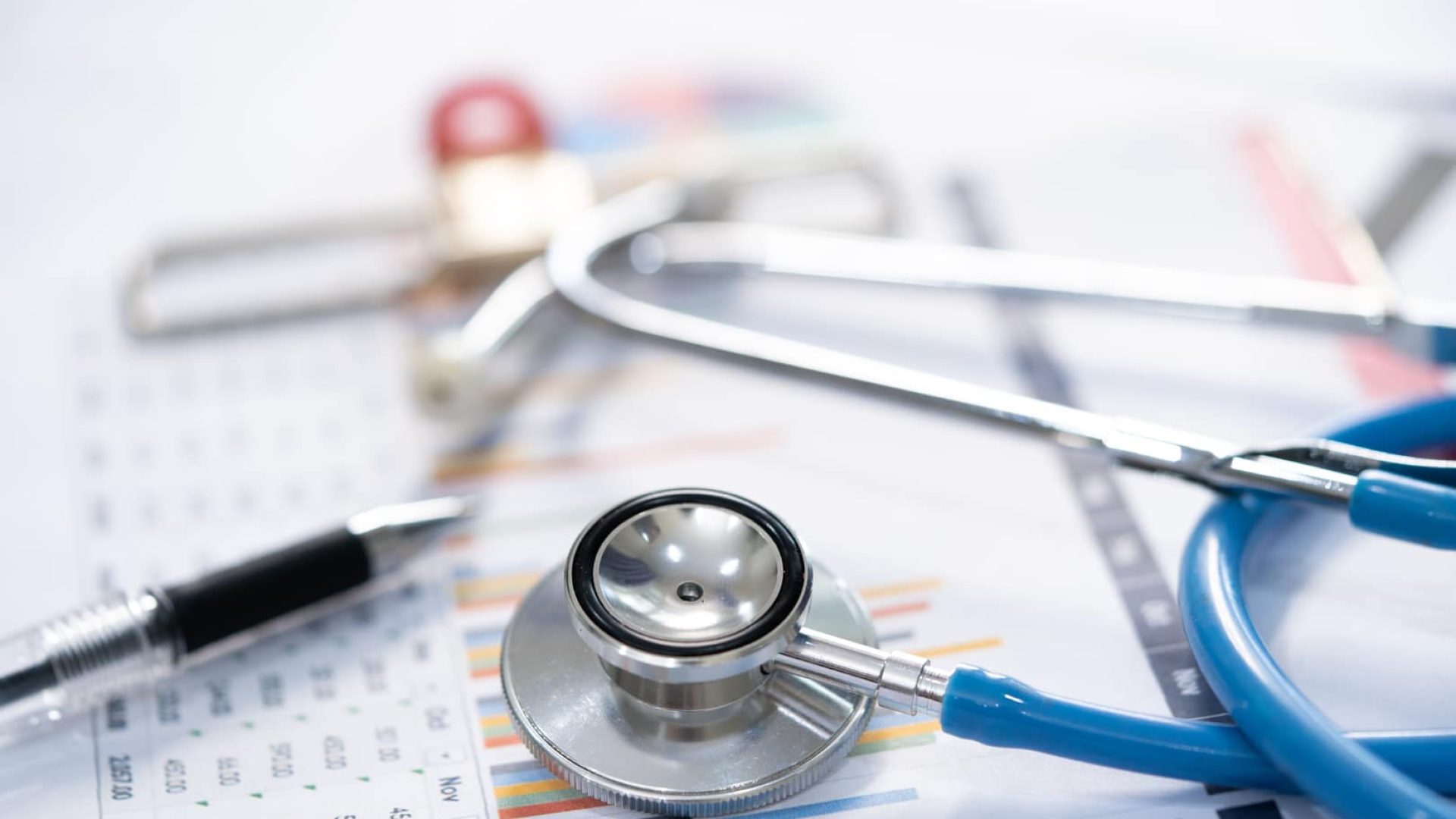 Stethoscope and Charts , Saving stack coins money, globe and credit card. Finance, Account, Statistics, Investment, Analytic research data economy and Business company meeting concept.