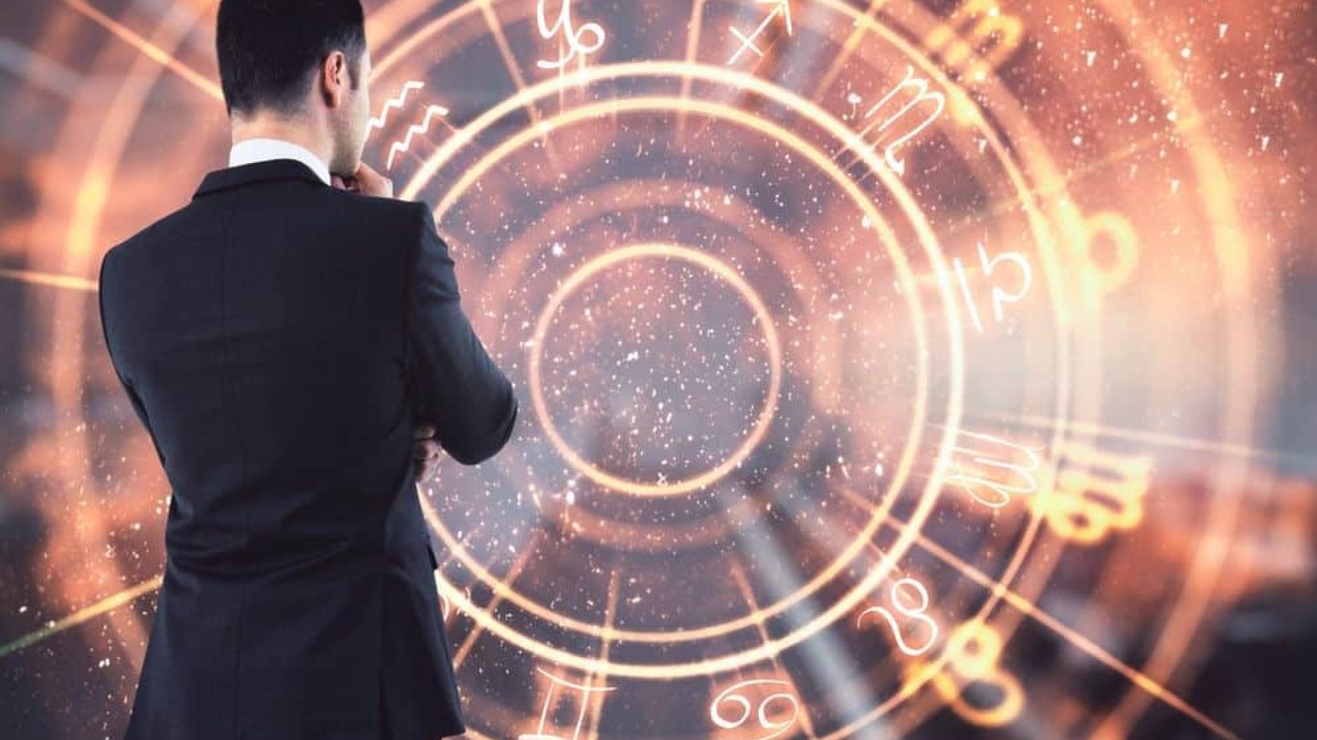 Back view of thoughtful young european businessman on blurry background looking at glowing horoscope wheel hologram. Business forecasting and future concept. Double exposure